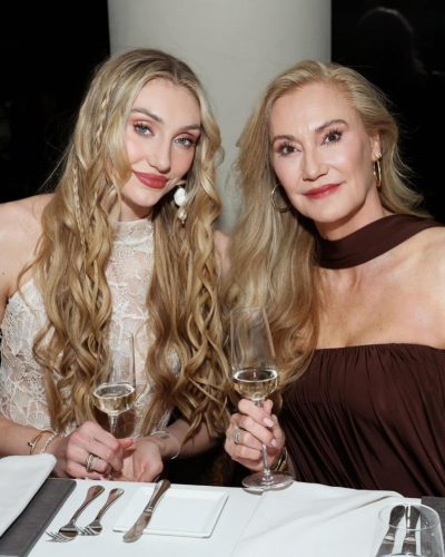 Cameron Brink wearing a beige lace top and shimmering mini skirt.