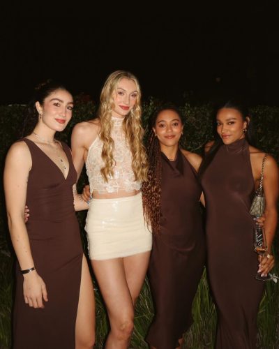 Cameron Brink with a lace top and a shimmering mini skirt.