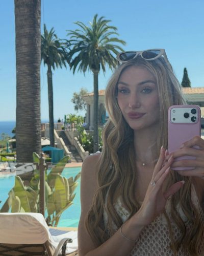 Cameron Brink styled in a soft beige top and shiny mini skirt.