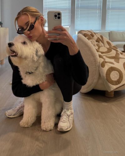 Cameron Brink in yellow halter dress complemented by purple bag.