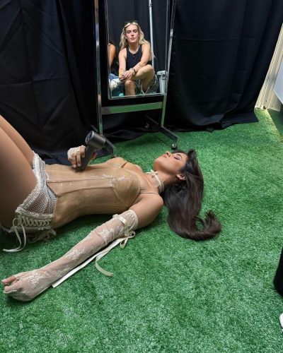 Camila Cabello in a red bikini reflecting summer fun.