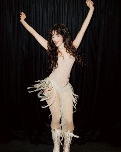 Camila Cabello in a red bikini with tousled beach hair.