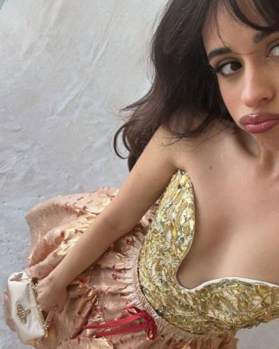 Camila Cabello in a stylish red bikini with minimal accessories.
