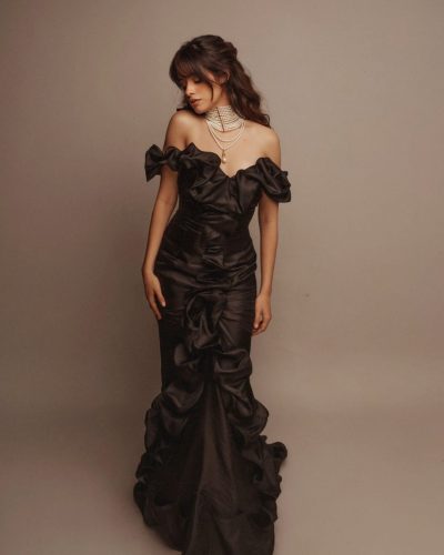 Camila Cabello in a red bikini enjoying a beach day.