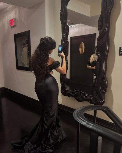 Camila Cabello in a red bikini with matching bottoms.