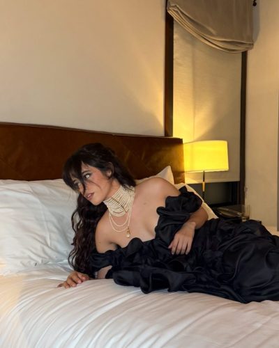 Camila Cabello in a red bikini with simple jewelry.