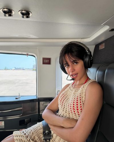 Camila Cabello in a red bikini with ring accent.