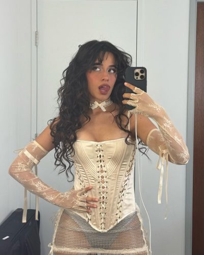 Camila Cabello in a stylish red bikini with minimal accessories.