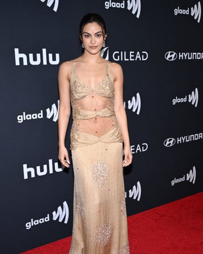 Camila Mendes chic drop earrings paired with her gown.