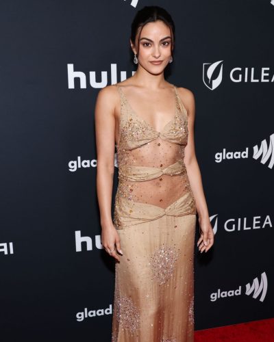 Camila Mendes sheer nude gown with intricate embellishments.