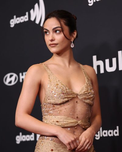 Camila Mendes modern gown with strategic cutouts and nude color.