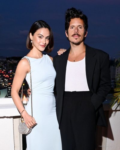 Camila Mendes in a fashionable pale blue dress paired with minaudière.