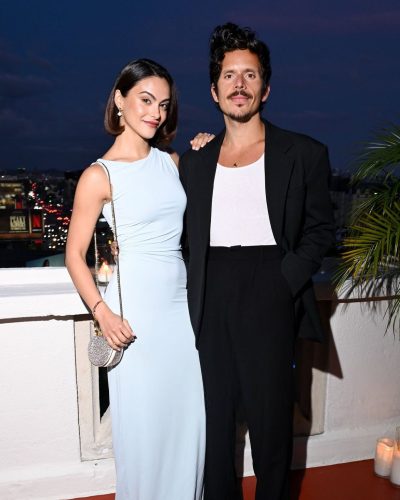 Camila Mendes dressed in a contemporary pale blue gown with unique design.