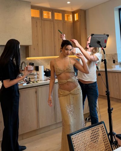 Camila Mendes in a radiant nude gown with graceful silhouette