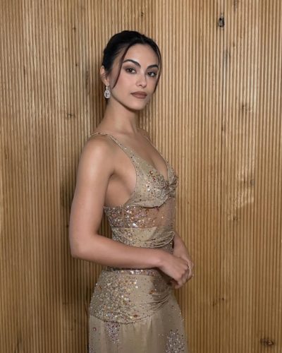 Camila Mendes in a beige dress featuring shimmering embellishments