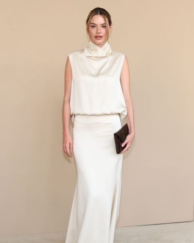 Camille Rowe in white gown at Gala Screening