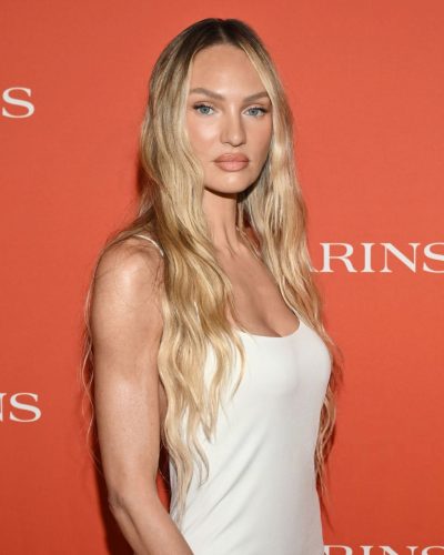 Candice Swanepoel classic white dress against orange backdrop