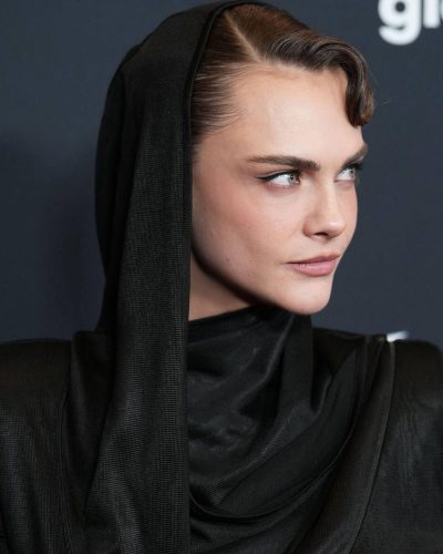 Cara Delevingne black gown paired with sleek pointed heels