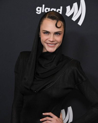 Cara Delevingne fitted black gown with sculptural silhouette