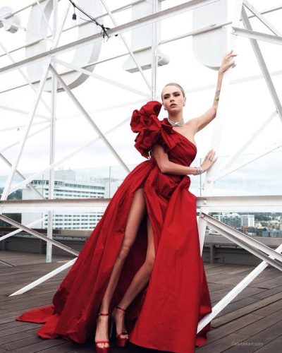 Cara Delevingne in a fitted red dress paired with platform heels