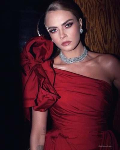 Cara Delevingne in a contemporary red gown with chic silhouette