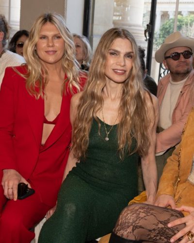 Carla Pereyra in mustard fringed coat with intricate beadwork