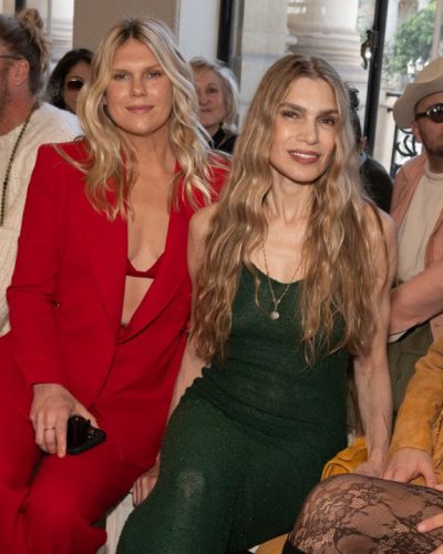 Carla Pereyra wearing matching fringed skirt and mustard handbag