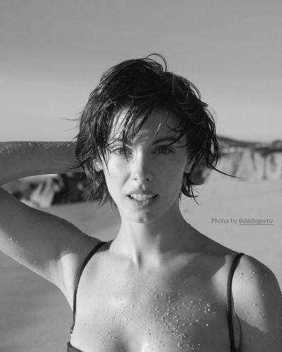 Carmella Rose in breathable light blue sports bra and shorts