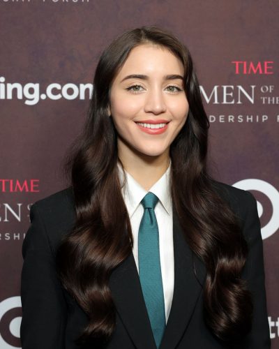 Caylee Cowan in a fitted black suit with stylish accessories