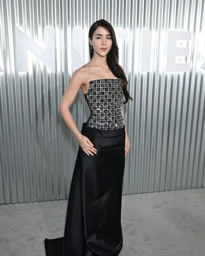 Caylee Cowan black gown with shimmering sequins and satin-like drape