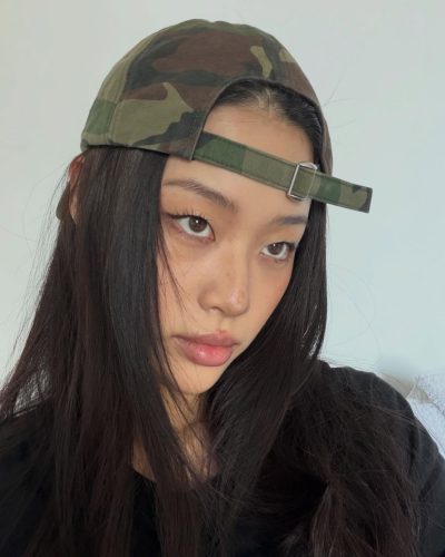 Cece Zhen in trendy brown top and sleek black shorts