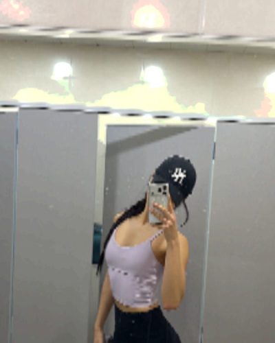 Cece Zhen in muted brown top with stylish black shorts