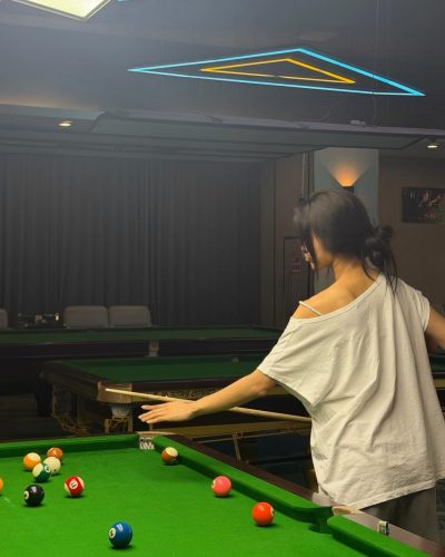 Cece Zhen wearing chic black handbag with casual outfit