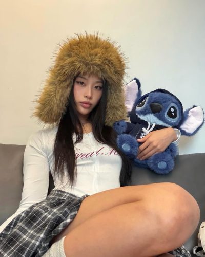 Cece Zhen in relaxed oversized brown top and black shorts