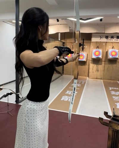 Cece Zhen wearing oversized sunglasses and relaxed brown top