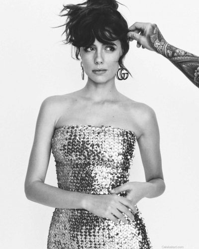 Celeste Dalla Porta in silver sequined dress with expressive eyes