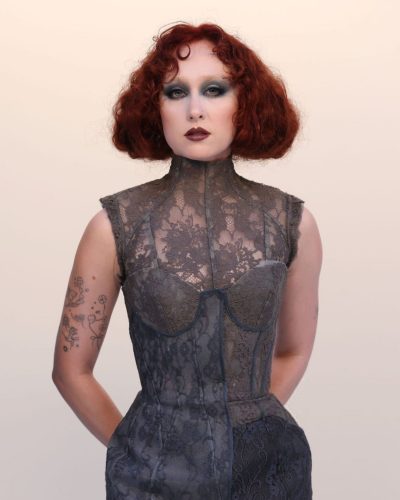 Chappell Roan gray lace gown with bold dark color palette