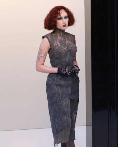 Chappell Roan fitted gray dress with mock turtleneck and lace gloves