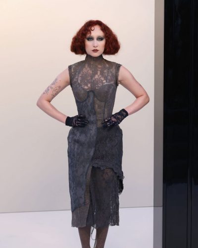 Chappell Roan gray gown with delicate lace patterns and dramatic length