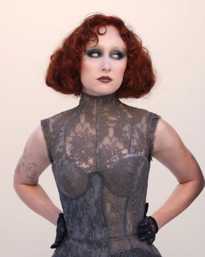 Chappell Roan gray lace dress with refined details and dramatic flair