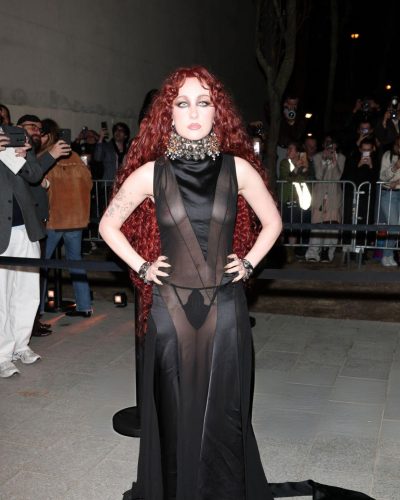 Chappell Roan wearing a black gown with sophisticated design elements.