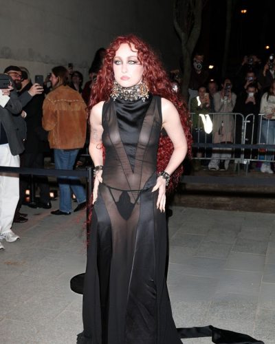 Chappell Roan in a black gown featuring intricate collar detailing.