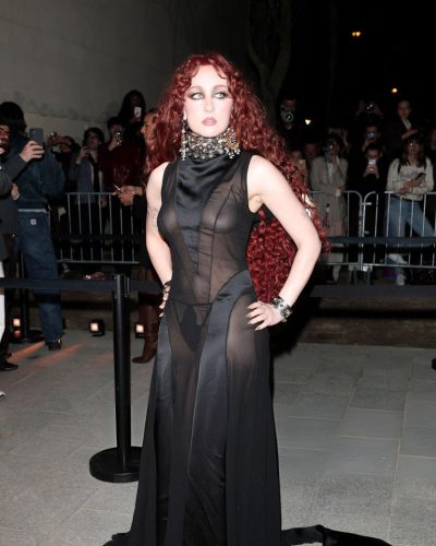 Chappell Roan in black gown with detailed embellishments around neckline.