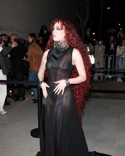 Chappell Roan in a black gown with intricate eye makeup.