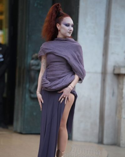 Chappell Roan in high-slit gown with flowing lavender fabric