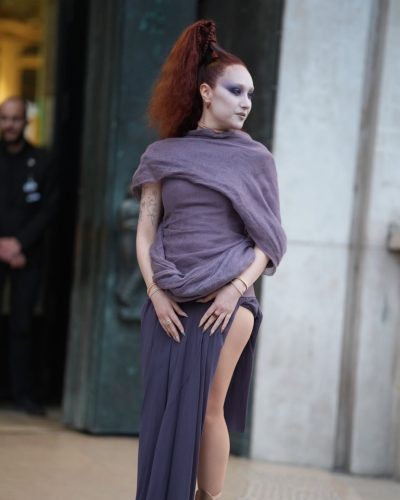 Chappell Roan wearing flowing lavender gown with daring high slit