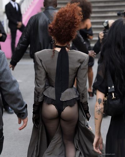 Chappell Roan in gray gown with delicate lace gloves