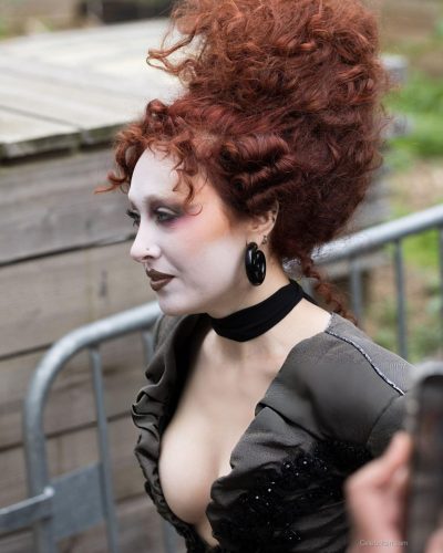 Chappell Roan in gray dress complemented by lace gloves