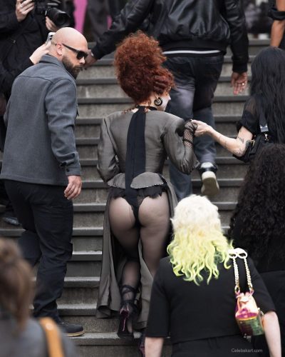 Chappell Roan wearing a gray embellished long sleeve gown