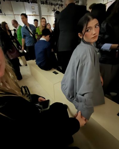 Charli D'Amelio with black hoodie and light gray sweatpants